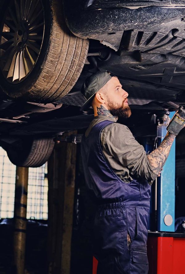 bearded-mechanic-working-with-the-cars-chassis-in-small.jpg bearded-mechanic-working-with-the-cars-chassis-in-small.jpg
