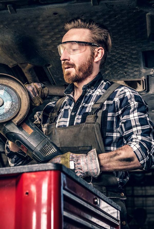 mechanic-in-protective-googles-holds-angle-grinder-small.jpg mechanic-in-protective-googles-holds-angle-grinder-small.jpg